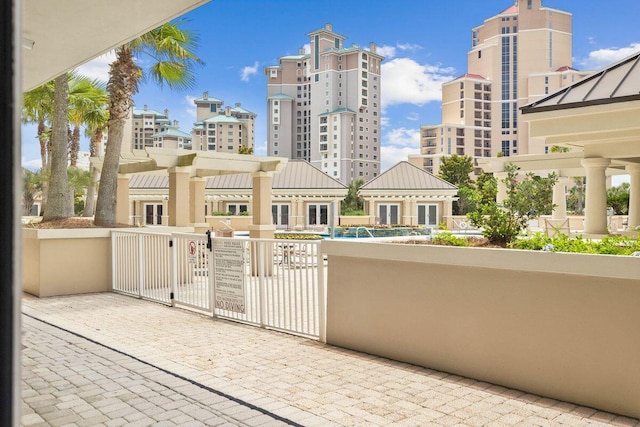 balcony featuring a pergola