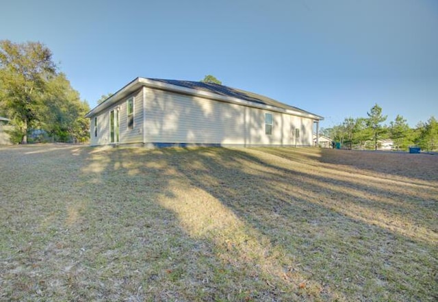 view of home's exterior featuring a lawn