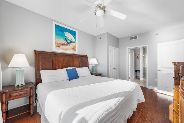 bedroom featuring ceiling fan, dark hardwood / wood-style flooring, and a closet