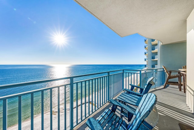 balcony featuring a water view