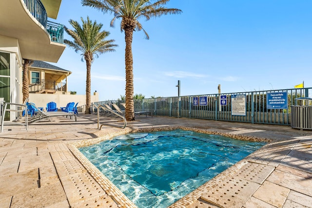 view of swimming pool featuring a patio