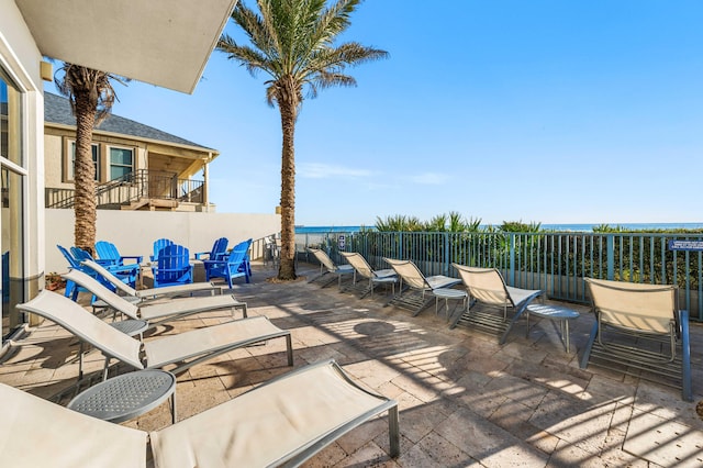 view of patio featuring a water view