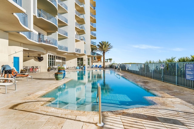 view of swimming pool featuring a patio area