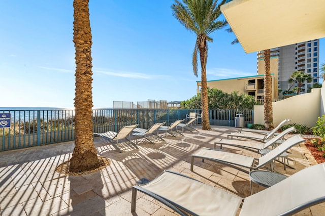 view of patio with a water view