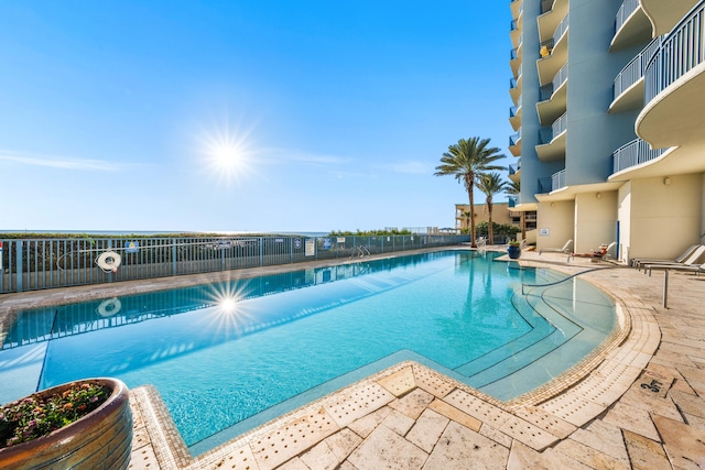 view of swimming pool with a patio area