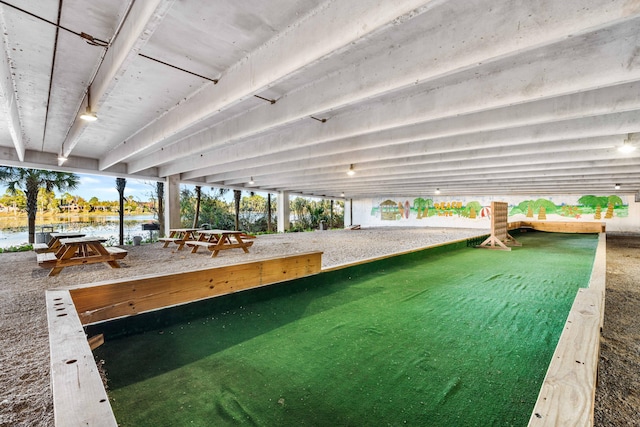 view of pool featuring a water view