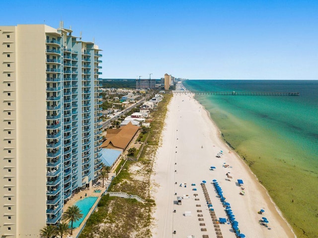 aerial view featuring a water view and a beach view