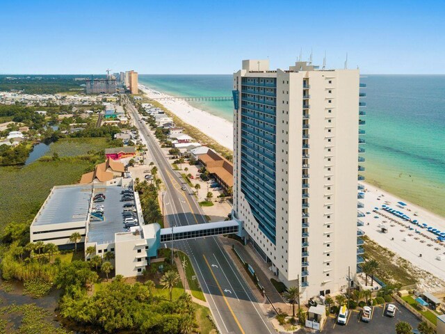 bird's eye view with a view of the beach and a water view