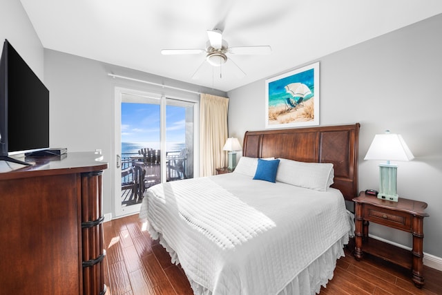 bedroom featuring dark hardwood / wood-style floors, ceiling fan, and access to outside