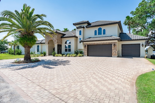 mediterranean / spanish-style house featuring a garage