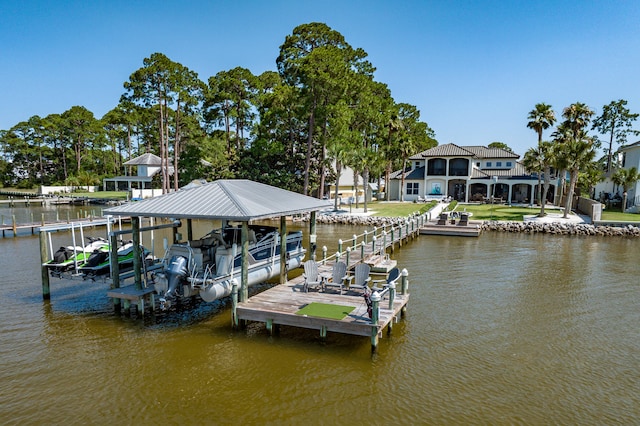 dock area with a yard and a water view