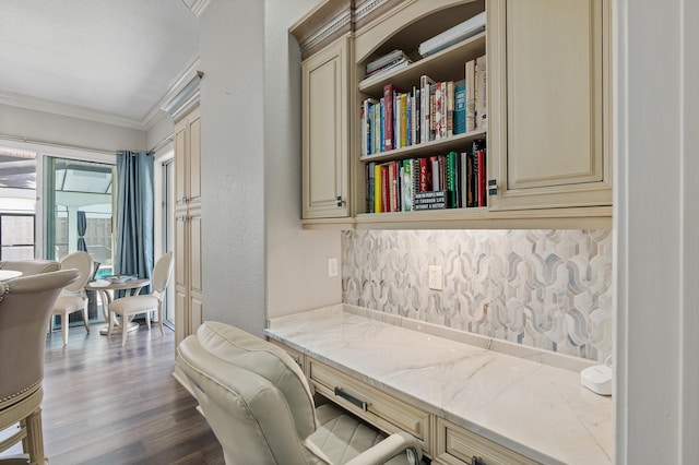 office area with dark hardwood / wood-style floors and crown molding