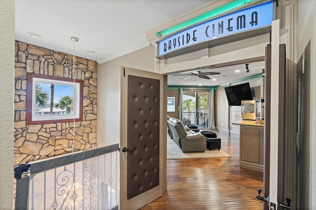 hallway with hardwood / wood-style flooring and crown molding