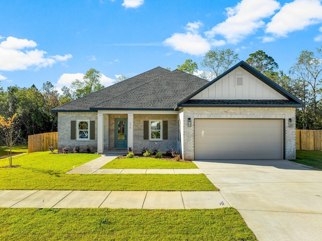 view of front facade featuring a front yard and a garage