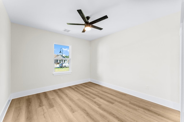 unfurnished room with ceiling fan and light wood-type flooring