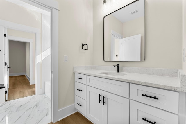 bathroom with vanity and hardwood / wood-style flooring