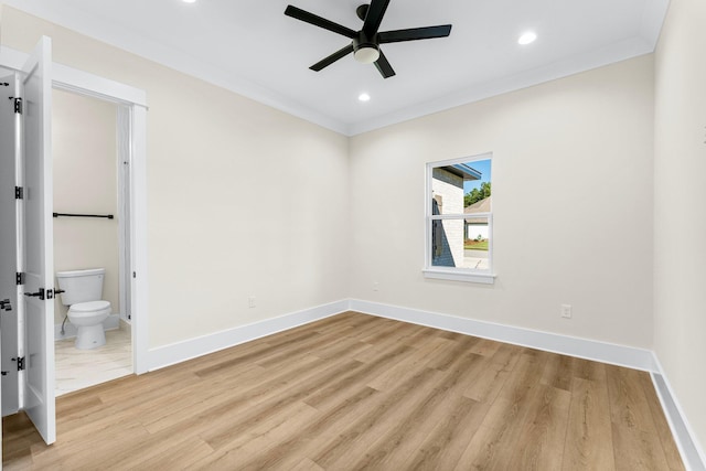 spare room with ceiling fan, crown molding, and light hardwood / wood-style flooring