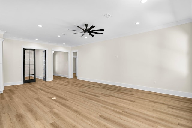 spare room featuring ceiling fan, light hardwood / wood-style flooring, french doors, and ornamental molding