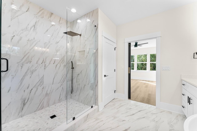 bathroom with ceiling fan, an enclosed shower, and vanity