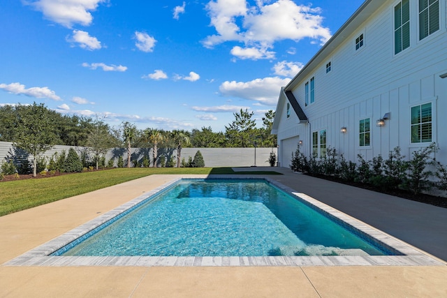 view of pool featuring a lawn and a patio area