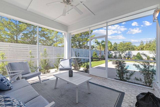 sunroom featuring ceiling fan and a healthy amount of sunlight