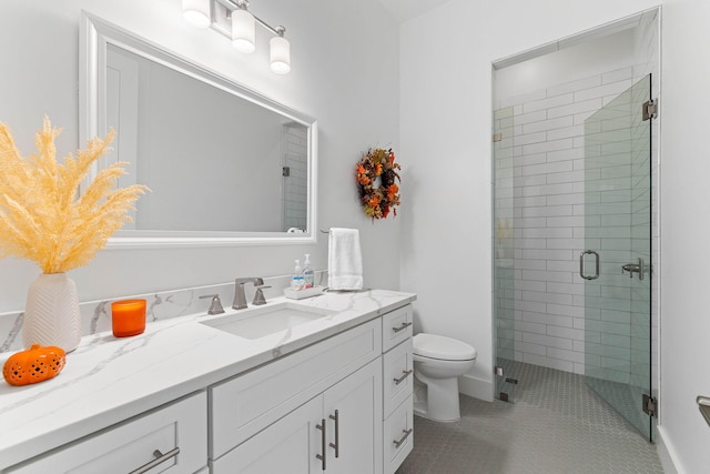 bathroom with tile patterned floors, toilet, an enclosed shower, and vanity