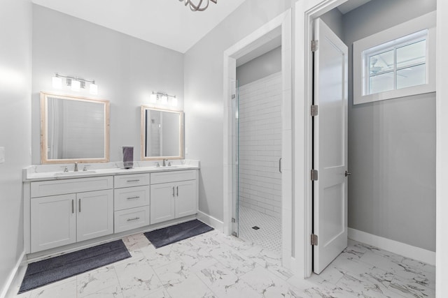 bathroom with vanity and tiled shower