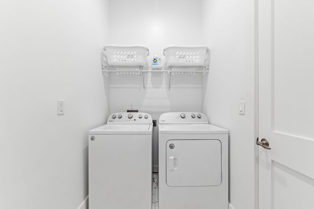 washroom featuring independent washer and dryer