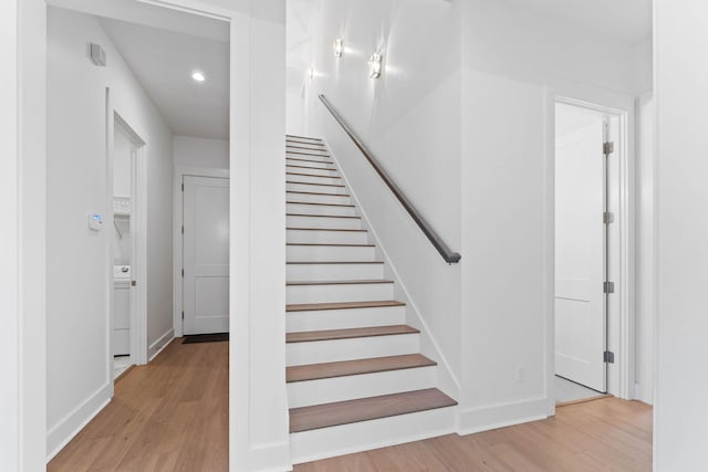 stairway with wood-type flooring