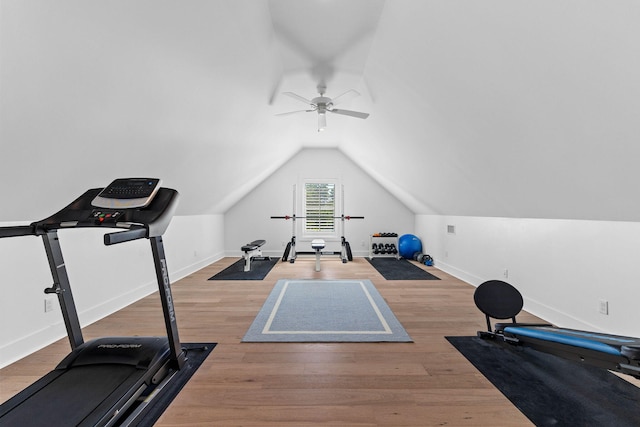 exercise area with ceiling fan, lofted ceiling, and hardwood / wood-style flooring