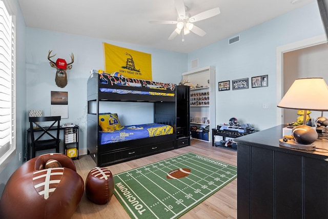 bedroom featuring ceiling fan and hardwood / wood-style floors