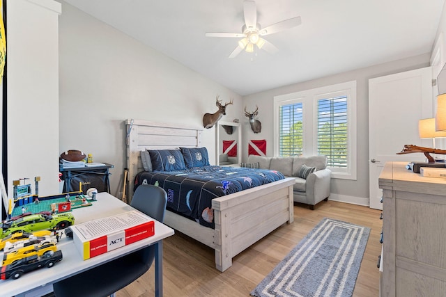 bedroom with ceiling fan and light hardwood / wood-style floors