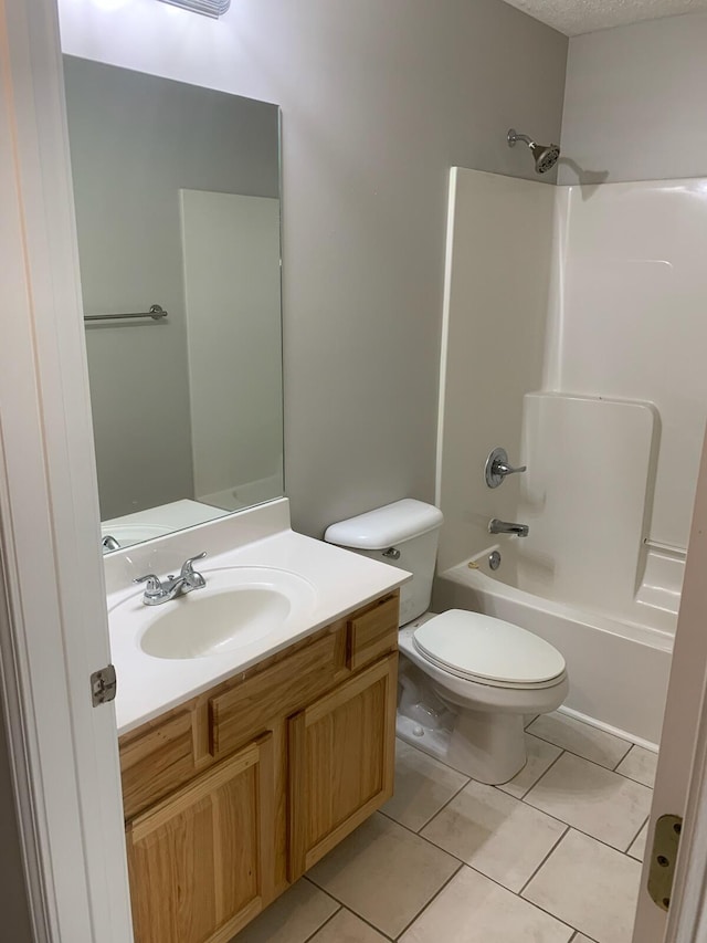 full bathroom featuring tile patterned flooring, a textured ceiling, toilet, vanity, and shower / bathtub combination