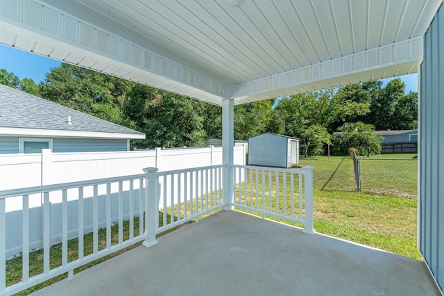 view of patio / terrace with a storage shed