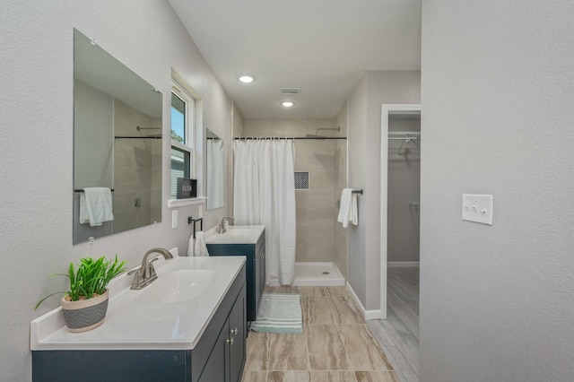 bathroom featuring hardwood / wood-style floors, vanity, and curtained shower