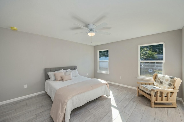 bedroom featuring ceiling fan and light hardwood / wood-style floors