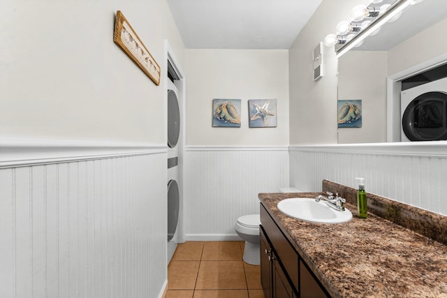 bathroom featuring tile patterned flooring, vanity, and toilet