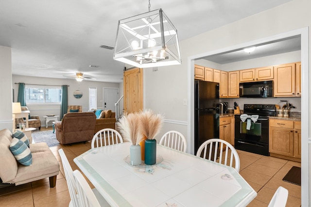 tiled dining room with ceiling fan