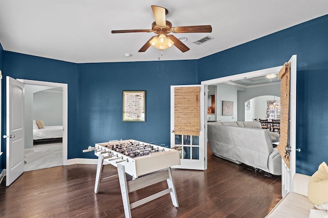 game room featuring dark hardwood / wood-style floors and ceiling fan