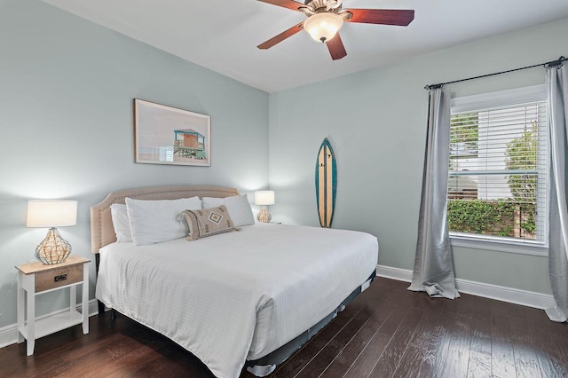 bedroom with ceiling fan and dark wood-type flooring