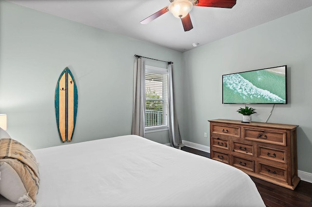 bedroom featuring ceiling fan and dark hardwood / wood-style floors