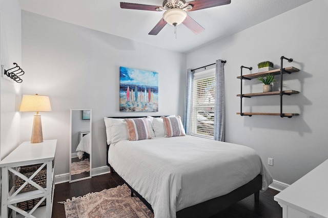 bedroom featuring dark hardwood / wood-style flooring and ceiling fan