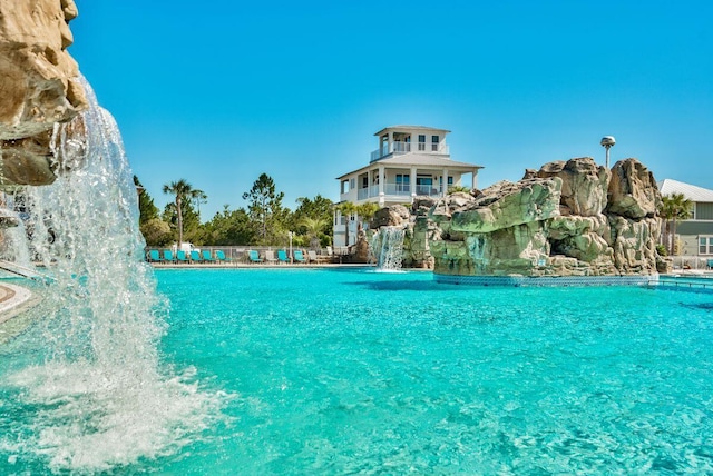 view of pool with pool water feature