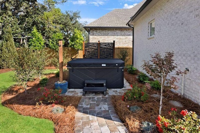 exterior space featuring a hot tub