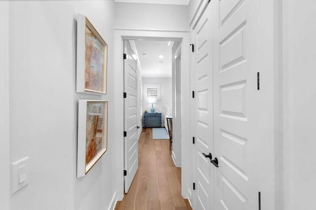 corridor featuring light hardwood / wood-style floors