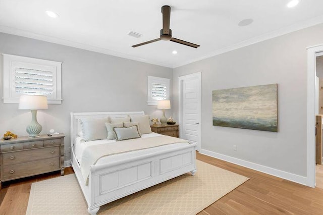 bedroom with ceiling fan, light wood-type flooring, and crown molding