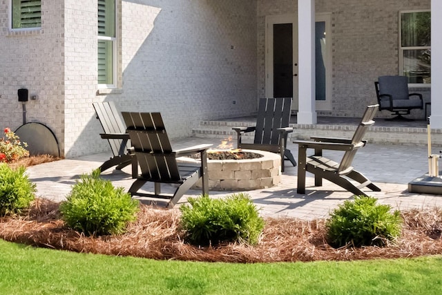 view of patio / terrace with a fire pit