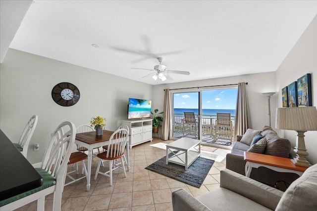 living room featuring ceiling fan and light tile patterned floors