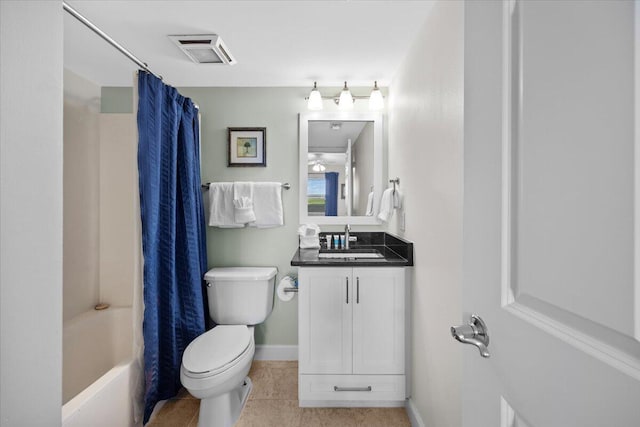 full bathroom featuring tile patterned flooring, shower / bath combo, vanity, and toilet