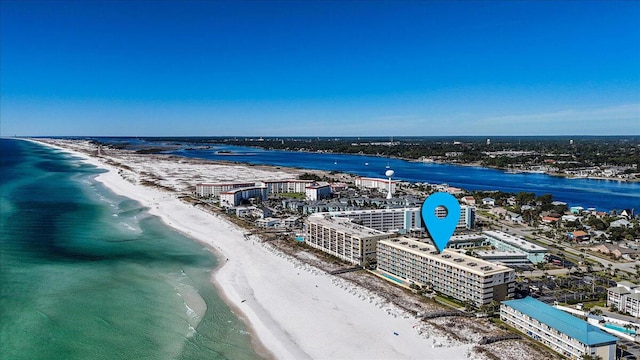 drone / aerial view with a water view and a view of the beach